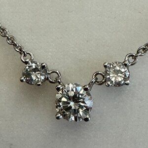 Lady’s 14ct white gold three-stone diamond necklace.